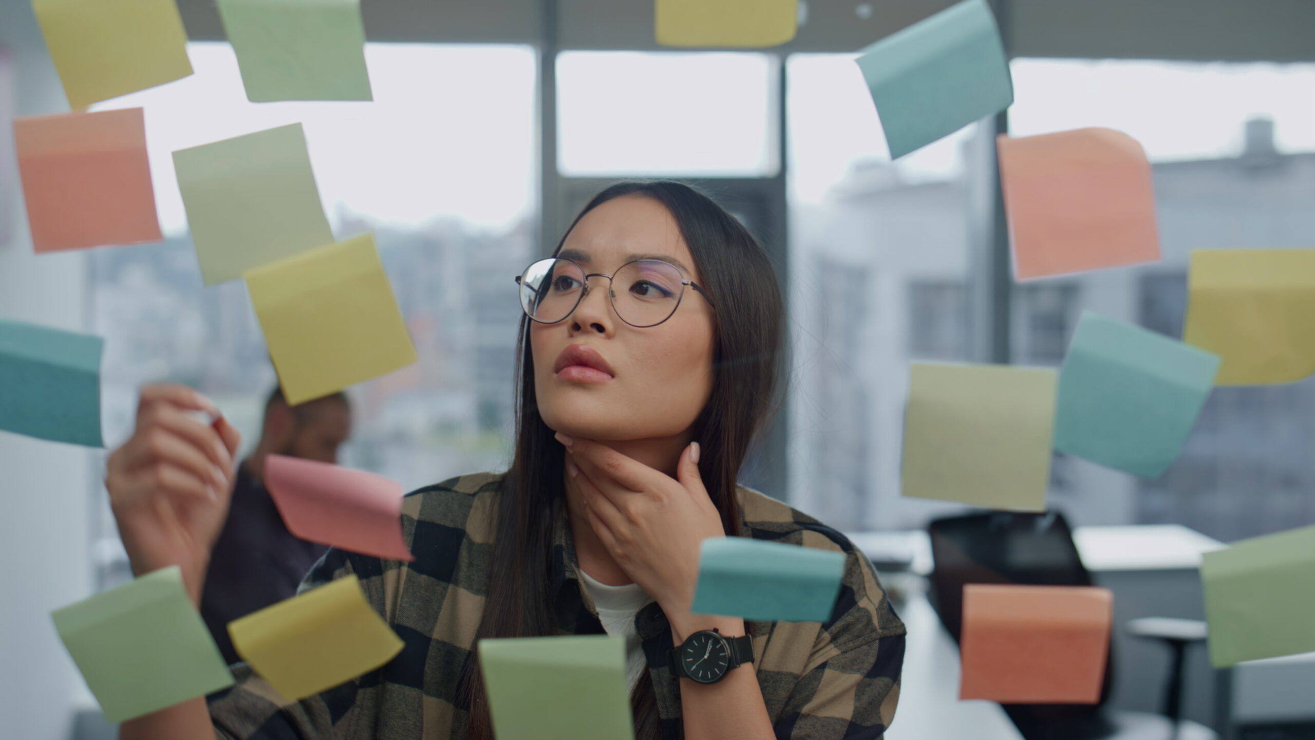 Marketing professional looking at research notes